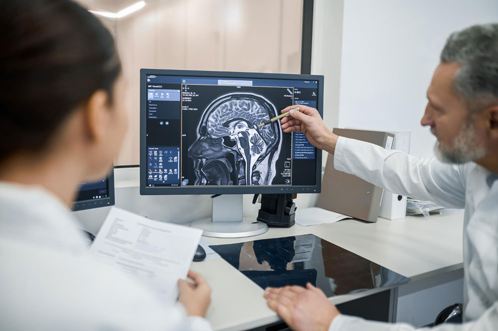 MR Personnel Studying Brain Scan